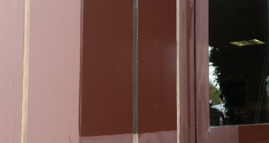 Sample clean of a faded powder coated window frame